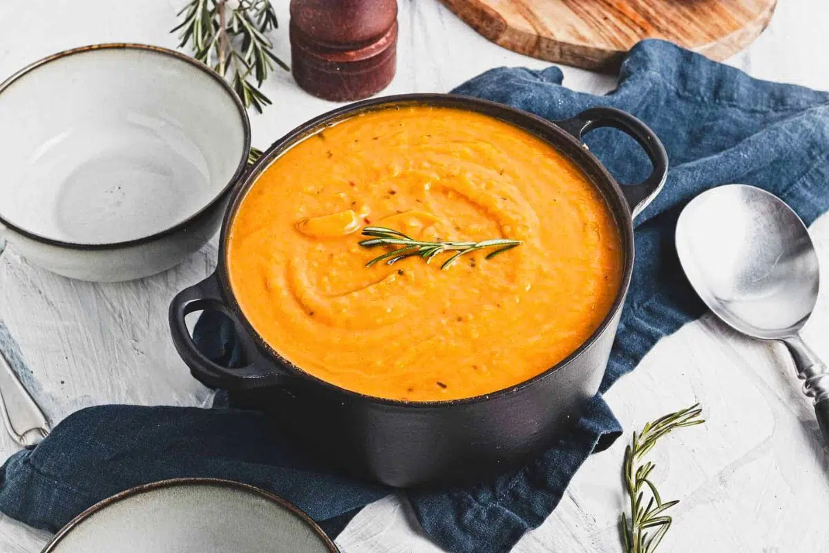 Roasted Butternut Squash Soup With Tomatoes in a pot.