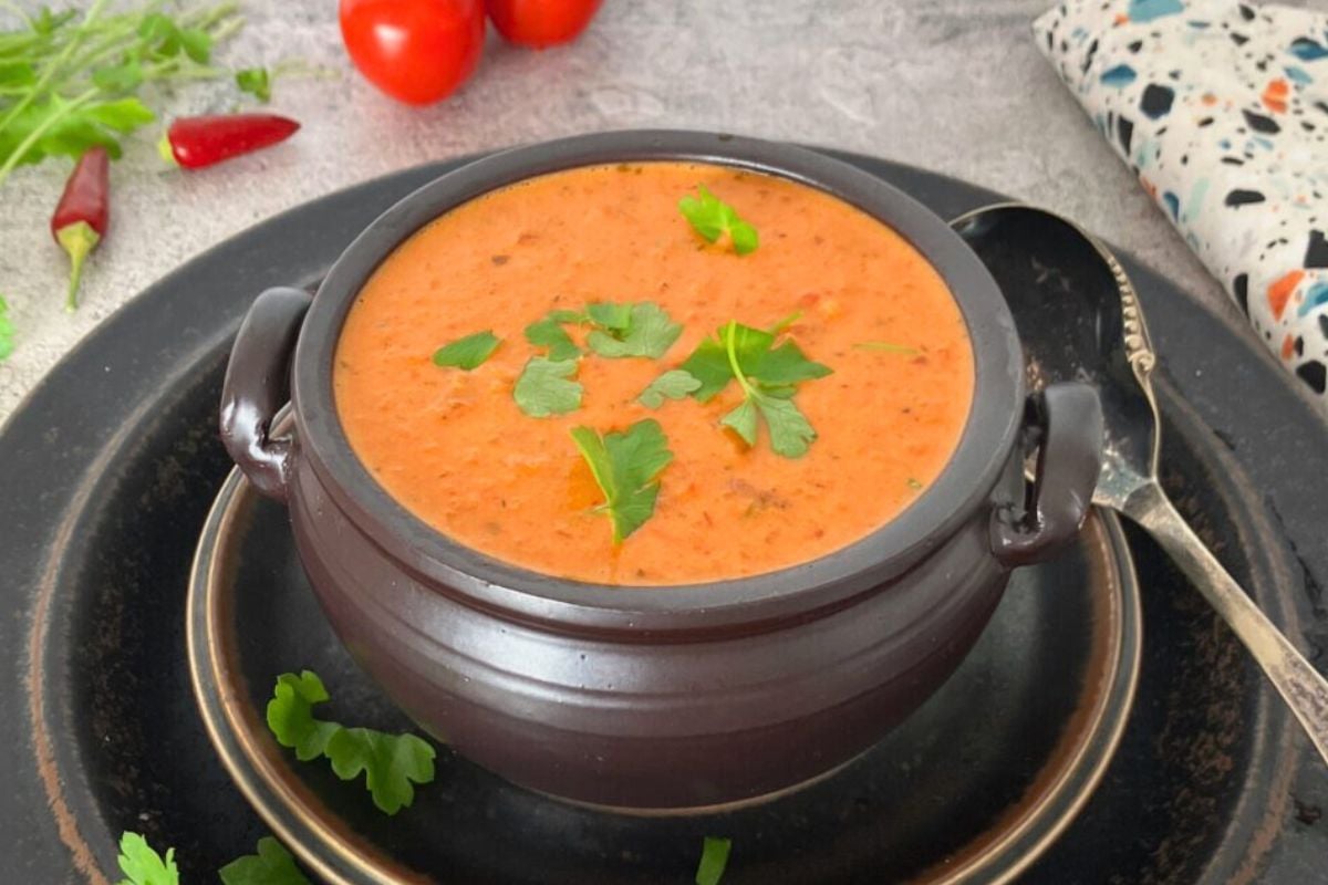 Spicy Roasted Vine Tomato and Red Onion Soup served in a bowl.