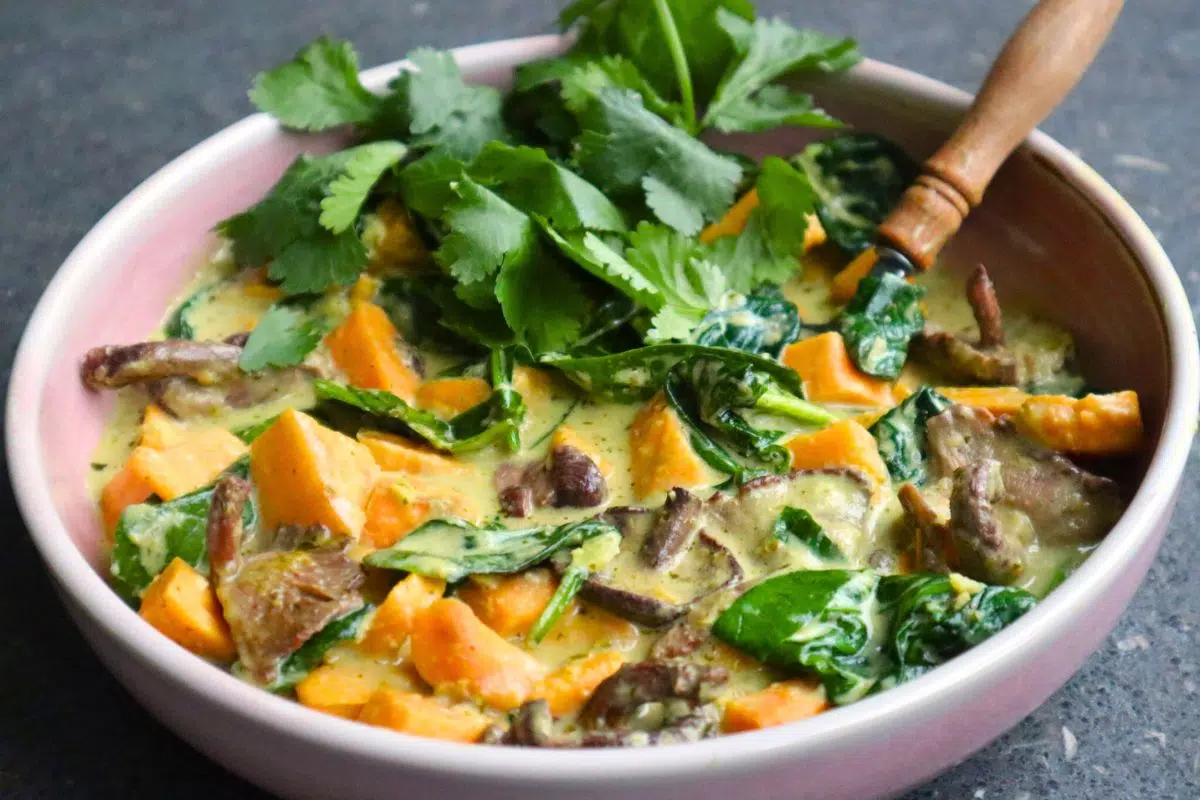 Thai green curry served in a bowl.