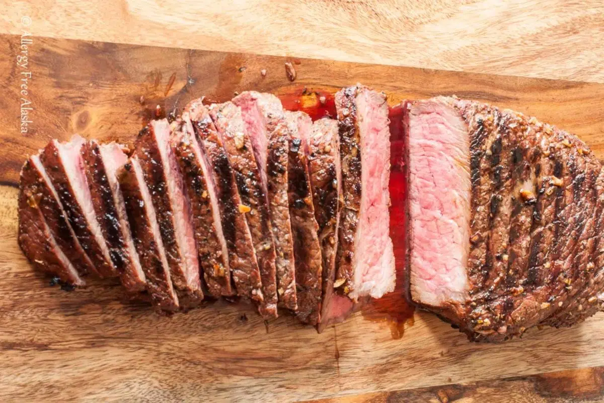 Easy London Broil Marinade cut on a cutting board.