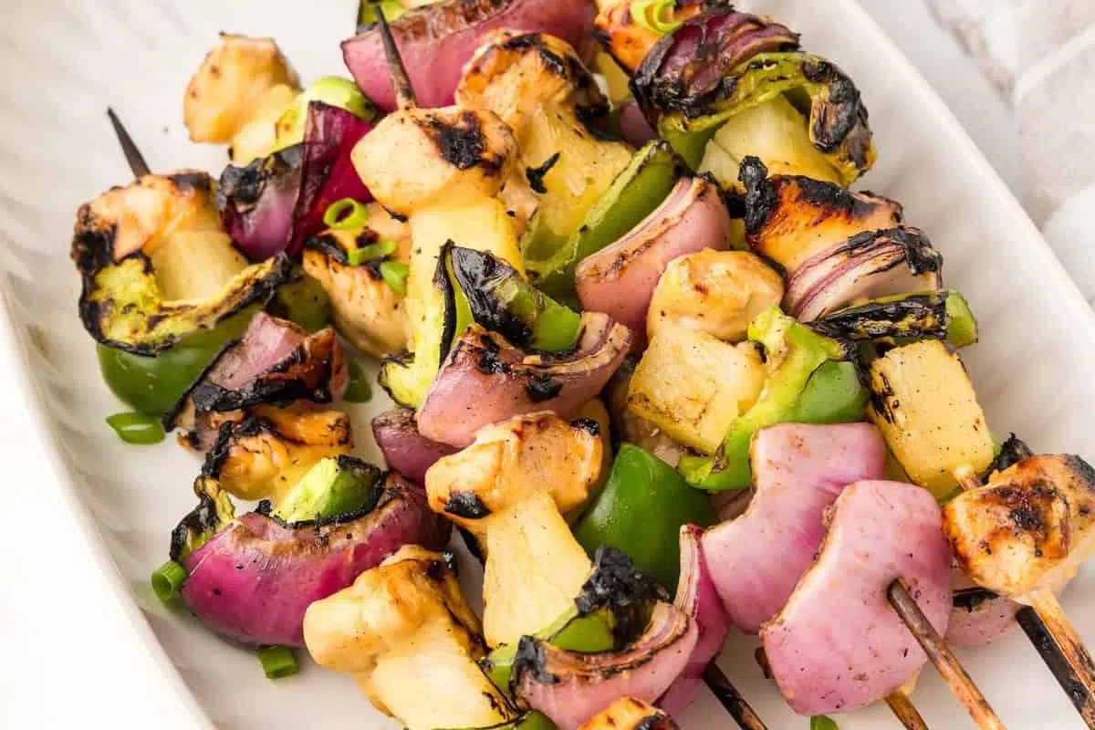 Pineapple Chicken Kabobs served in a plate.