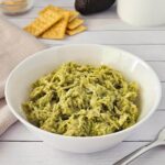 Avocado chicken salad in a white bowl.