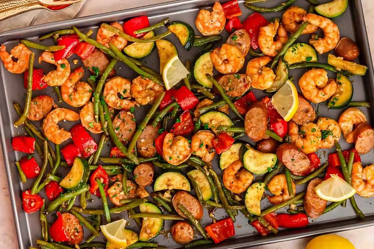A sheet pan full of shrimp, sausage, and veggies.