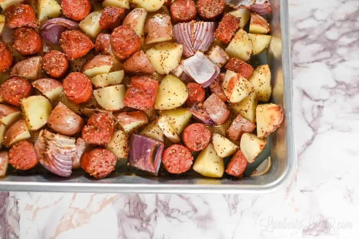 A sheet pan full of sausage and potatoes.