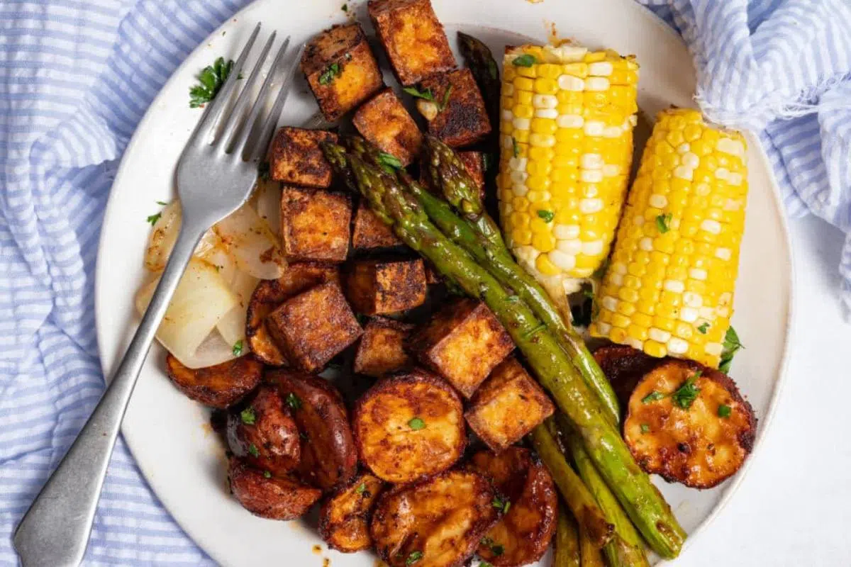 A plate of bbq tofu and veggies.
