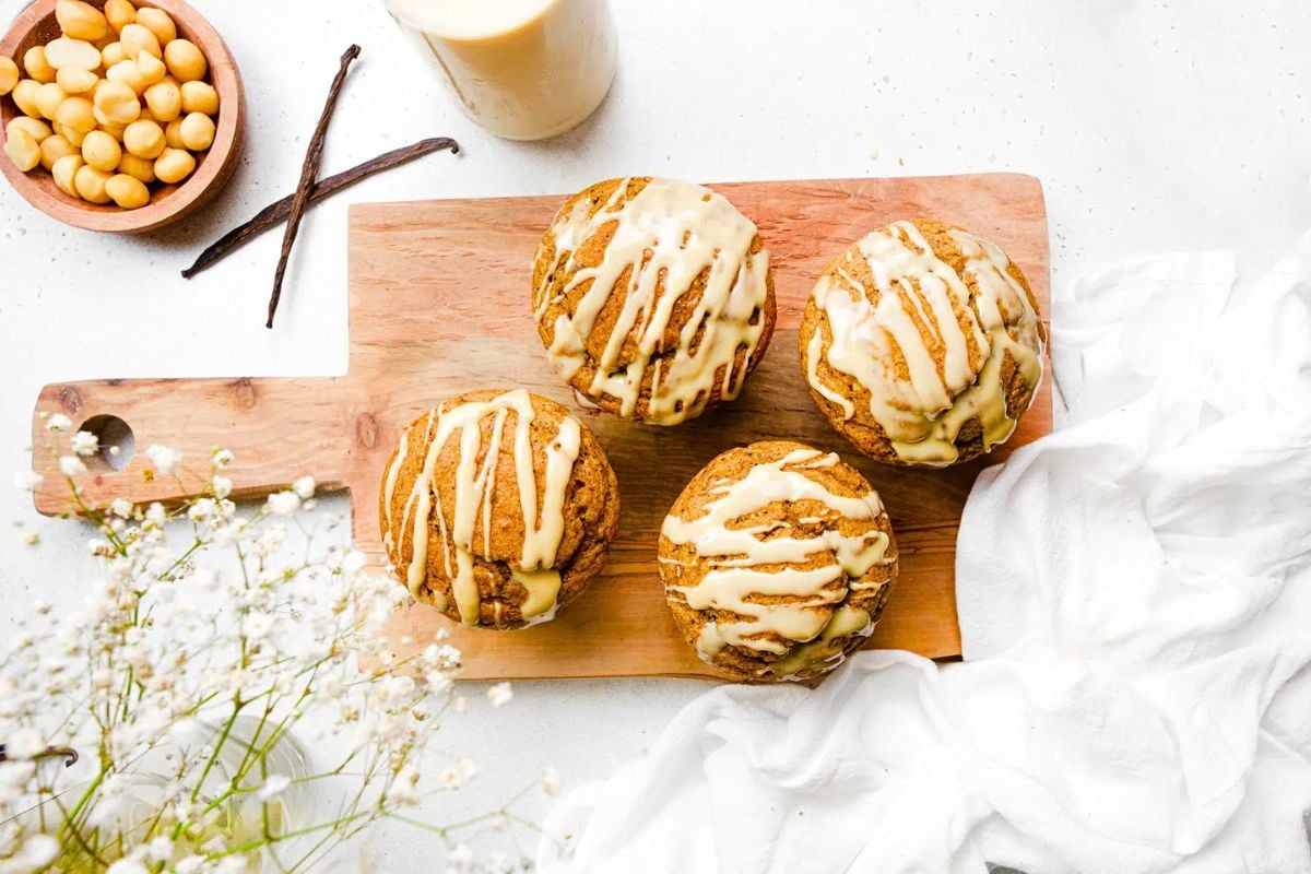 Bakery Style Gluten-Free Vanilla Muffins on a wooden board.