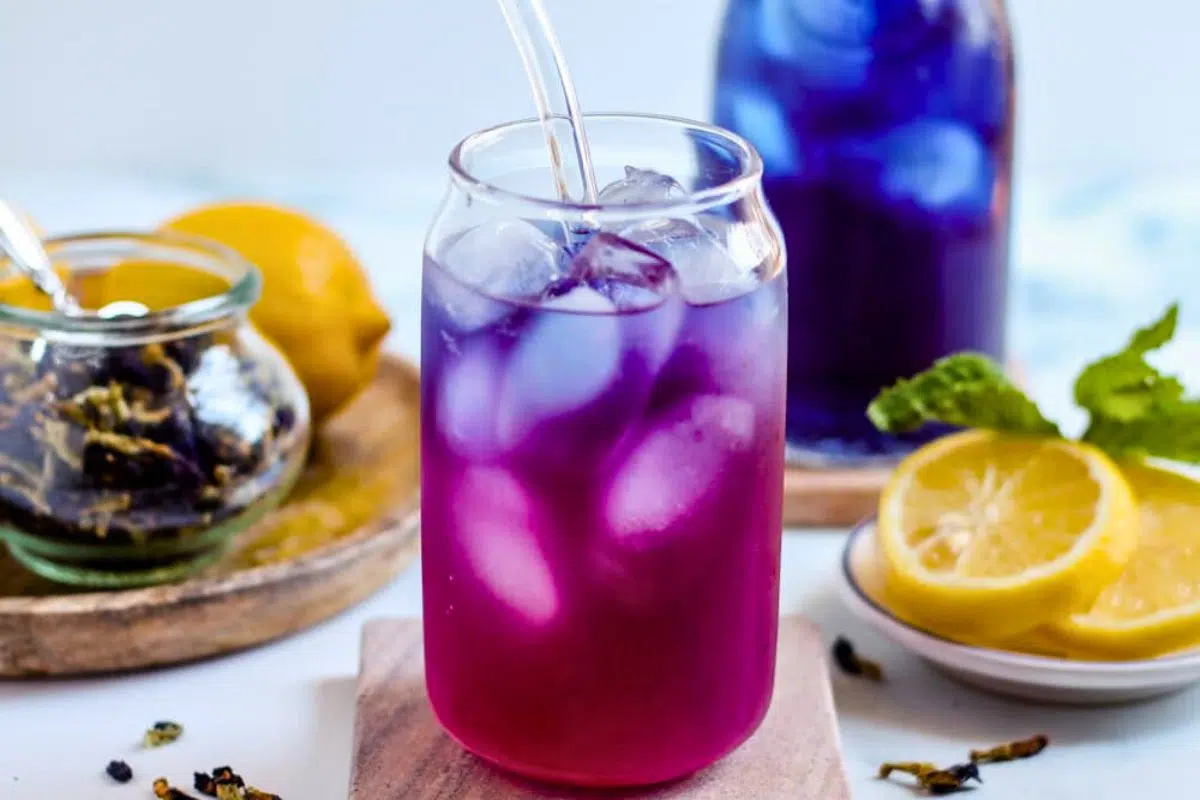 Butterfly Pea Tea served in a glass.