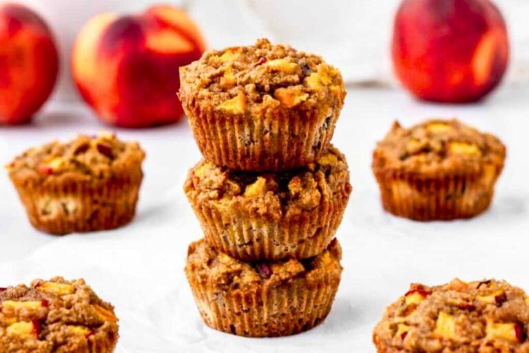 Gluten-Free Peach Muffins on a table.