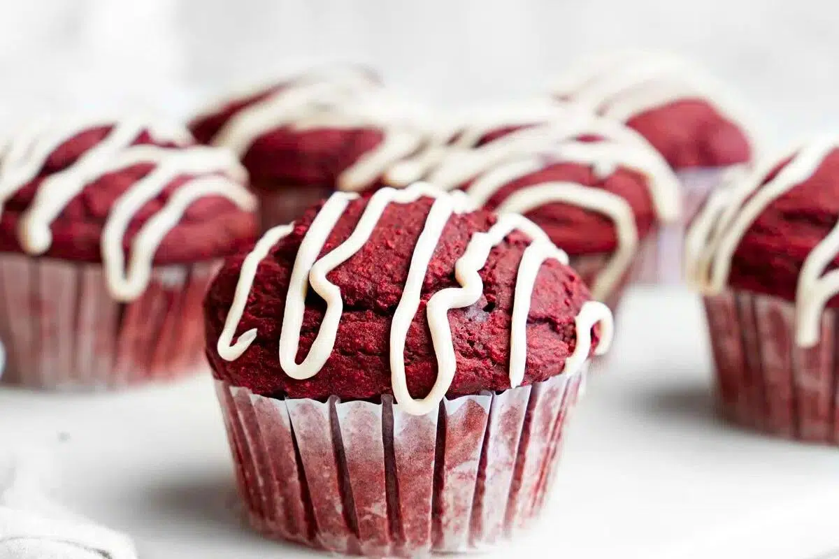 Gluten-Free Vegan Red Velvet Muffins drizzled with glaze.