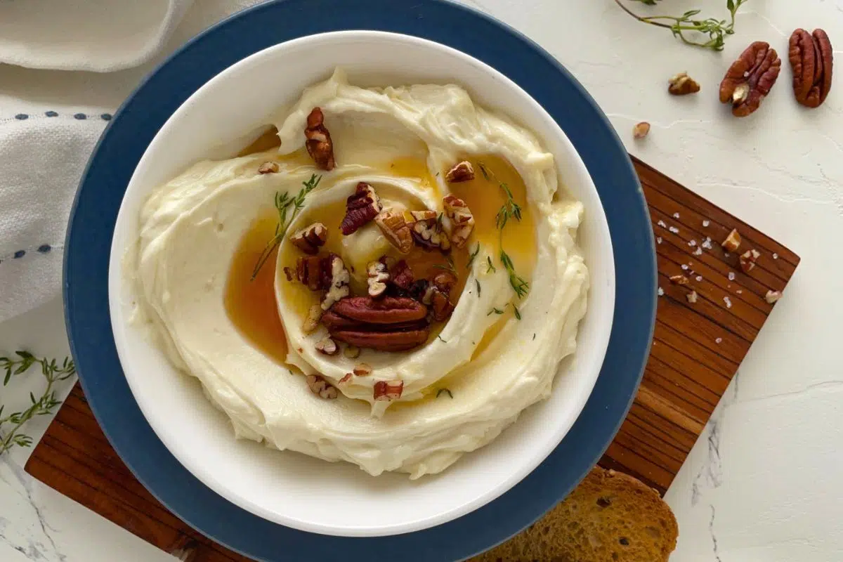 Honey Whipped Goat Cheese topped with pecans.
