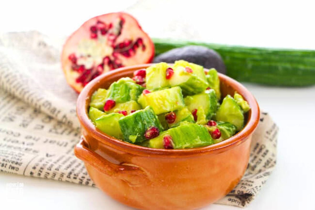 Keto Cucumber Avocado and Pomegranate Salad in a bowl.