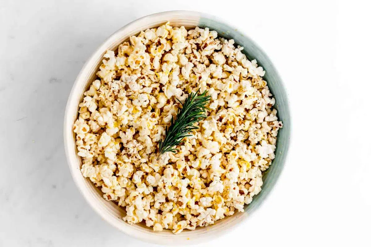 Lemon Parmesan Rosemary Popcorn served in a bowl.