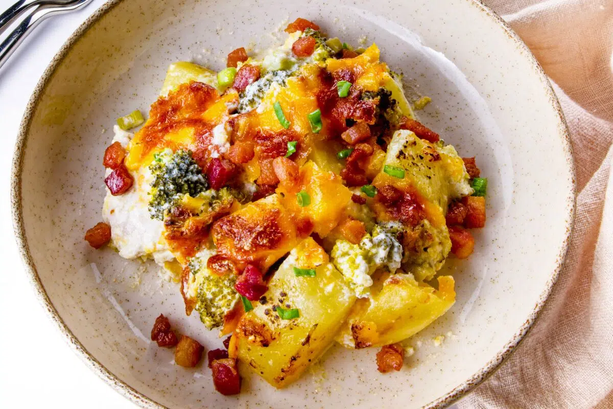 Loaded Cheesy Chicken Broccoli and Potato Casserole served on a plate.