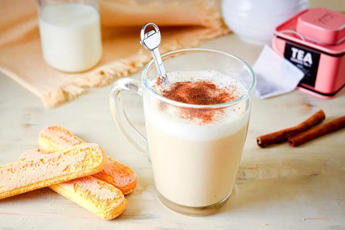 A cup of London Fog topped with cinnamon powder.