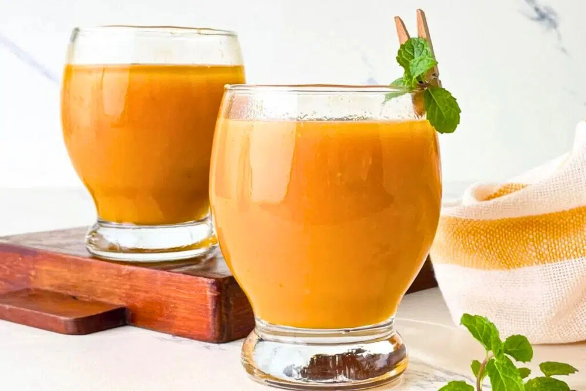 Mango Iced Tea topped with mint leaves.