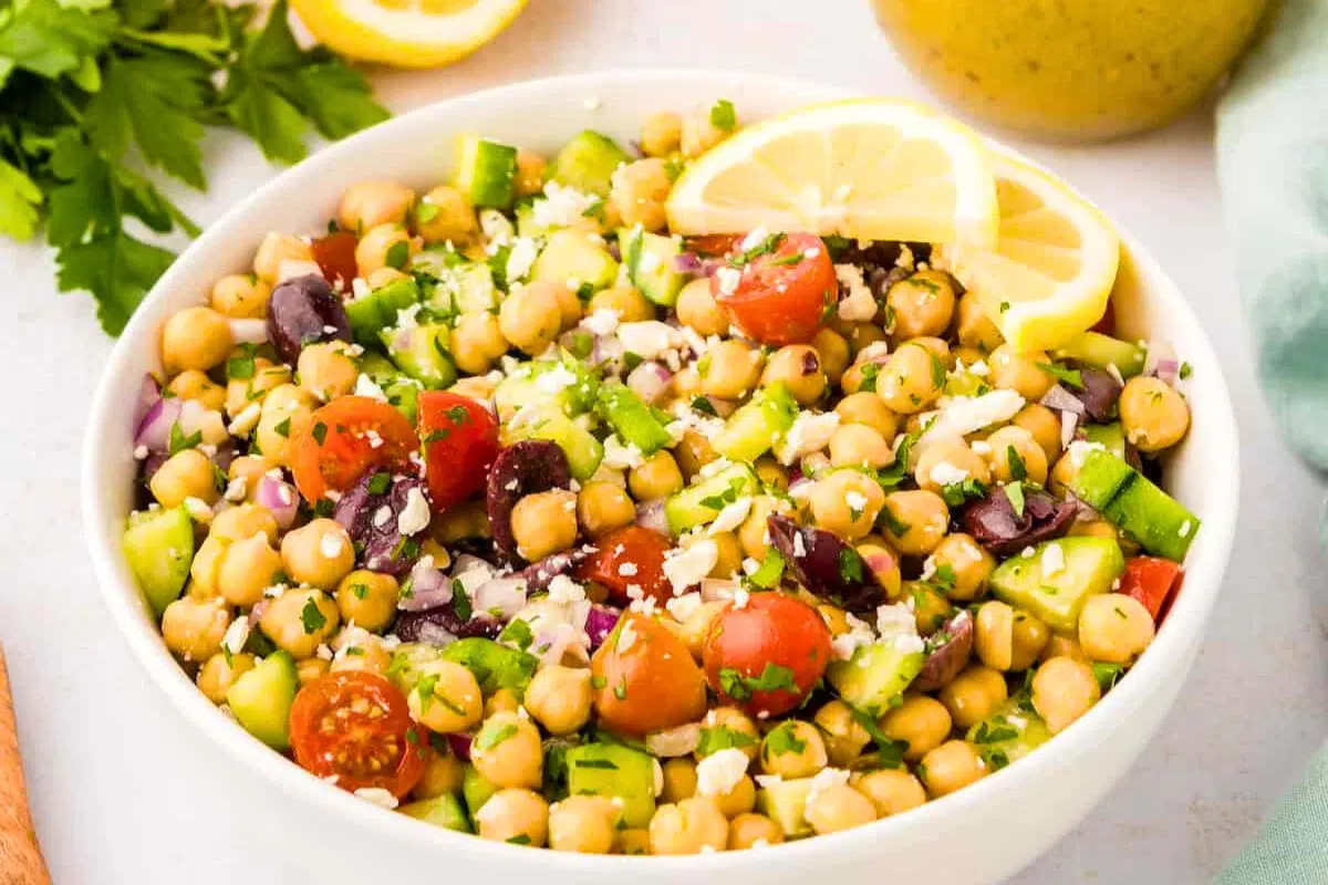 Mediterranean Chickpea Salad topped with a slice of lemon.