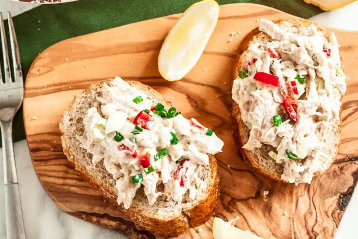 Rotisserie Chicken Salad served on a wooden board.