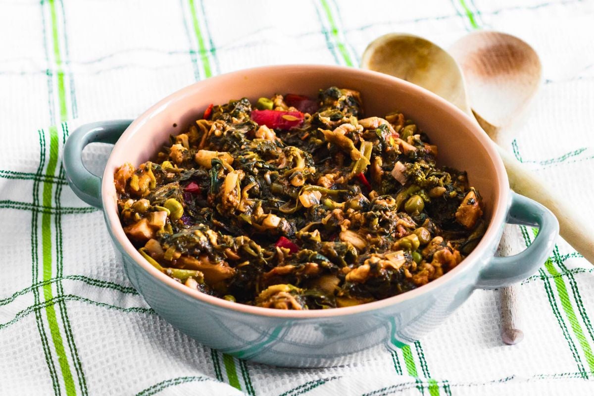 Sautéed Spinach with Mushrooms and Vegetables in a pan.