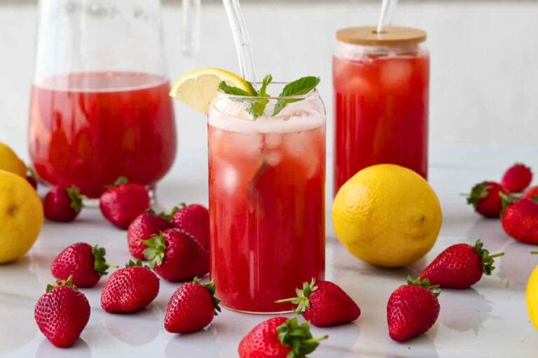 Strawberry Iced Tea topped with mint leaves and lemon.