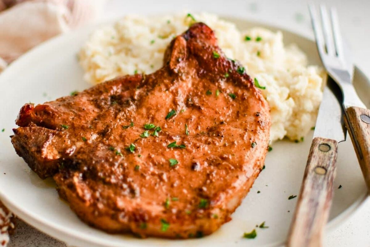 The Best Baked Pork Chops served on a late.