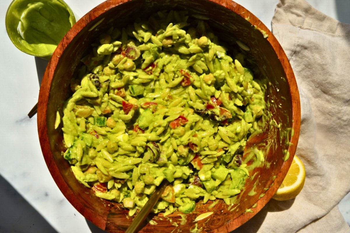 Vegan Orzo Salad with Creamy Avocado Dressing served in a wooden bowl.