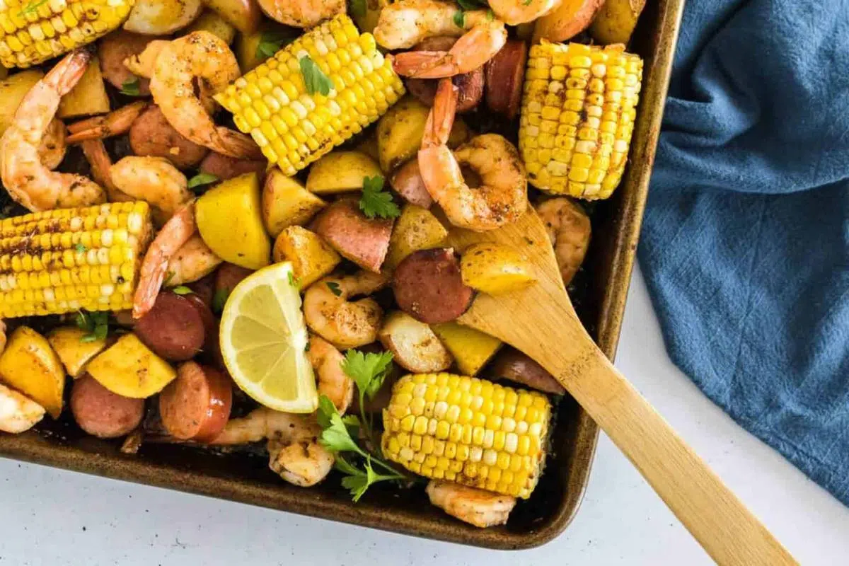 A shrimp boil recipe on a sheet pan.