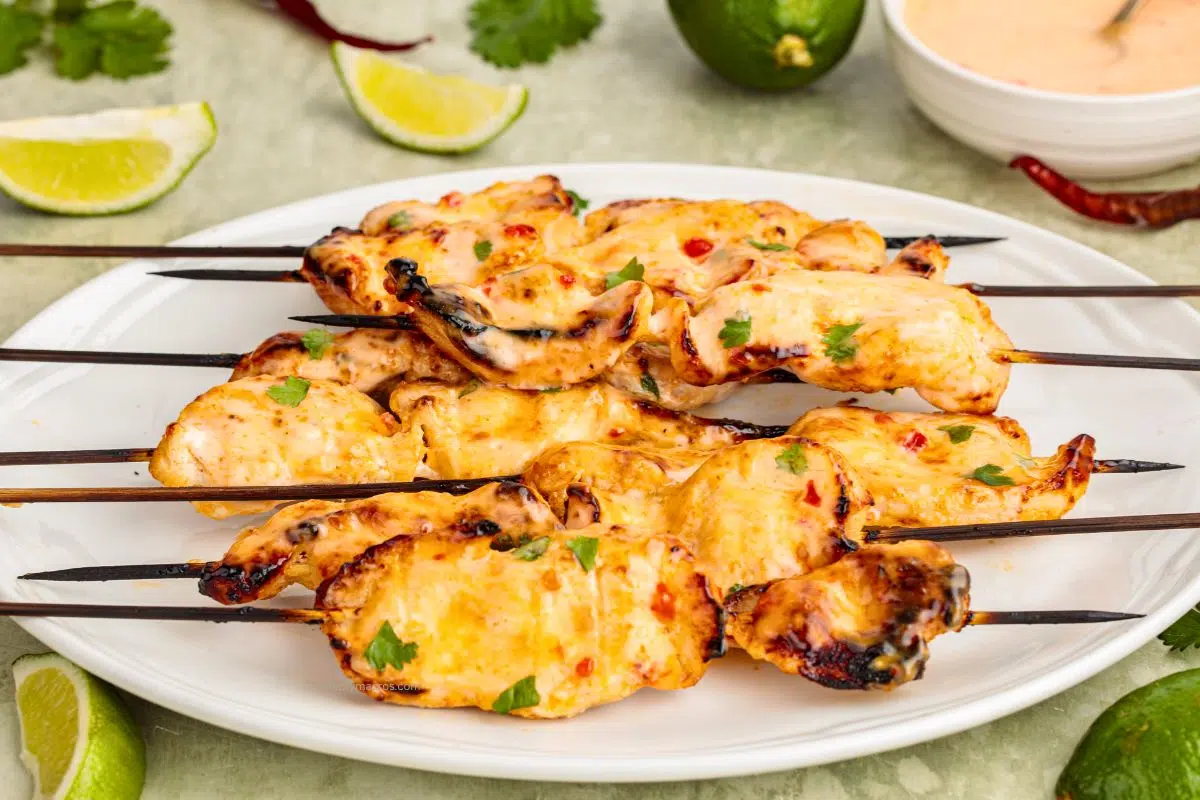 Bang Bang Chicken Skewers served on a plate.