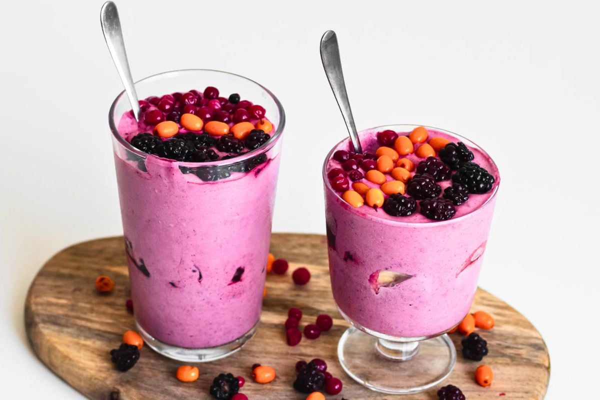 Berry Banana Keto Milkshake topped with berries.
