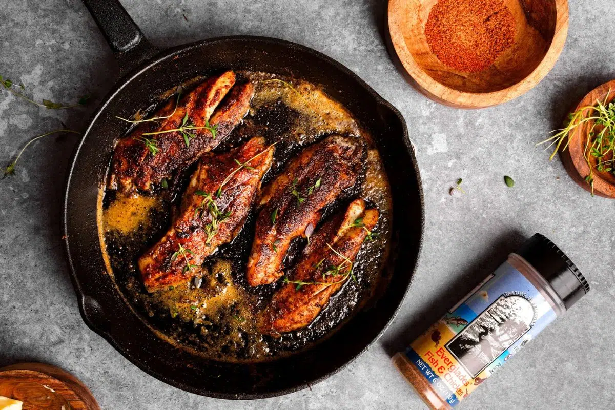 Blackened Sea Trout in a skillet.