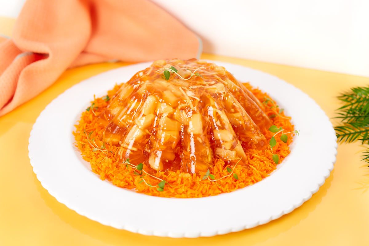 Carrot Pineapple Jello Salad served on a plate.