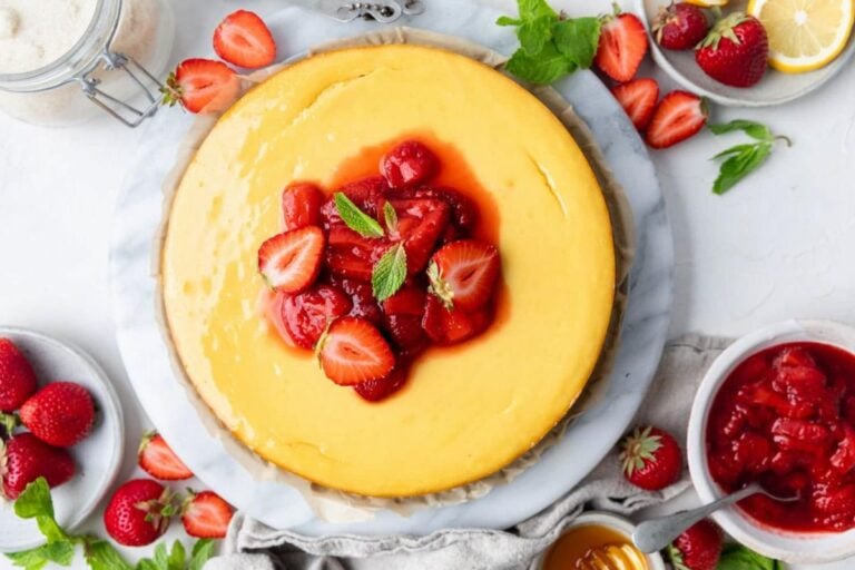 Cheesecake with strawberries on top.