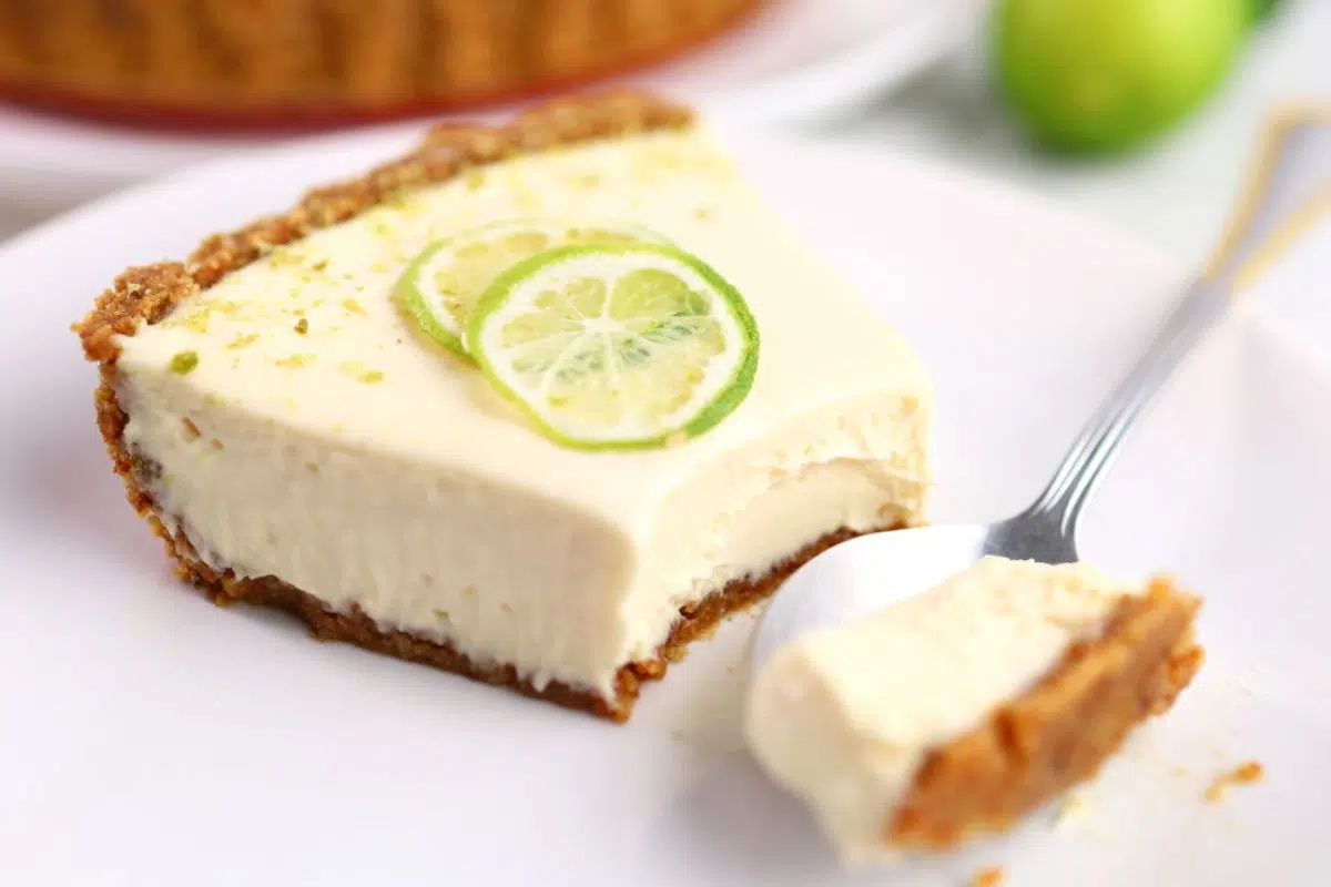 A slice of key lime pie cheesecake.