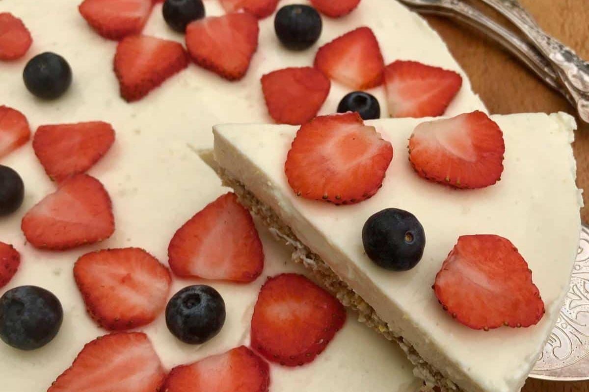 Lemon cheesecake with berries on top.