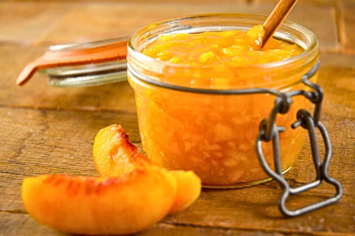 Peach Freezer Jam in a small jar.