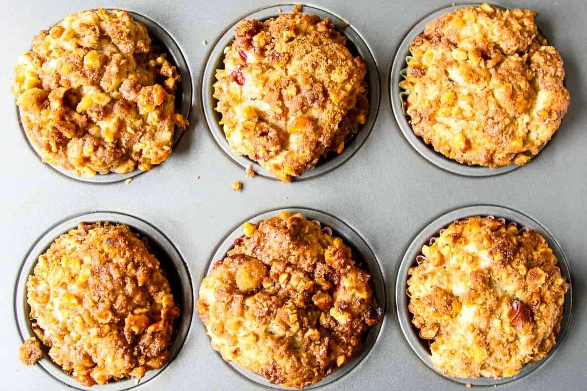 Strawberry Rhubarb Muffins in a muffin pan.