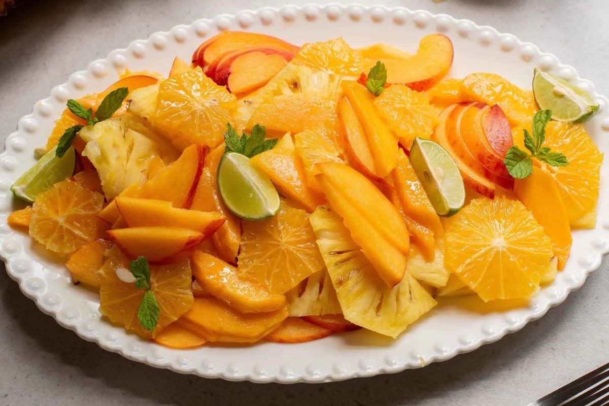 Summer Fruit Salad with Honey Lime Dressing on a plate.