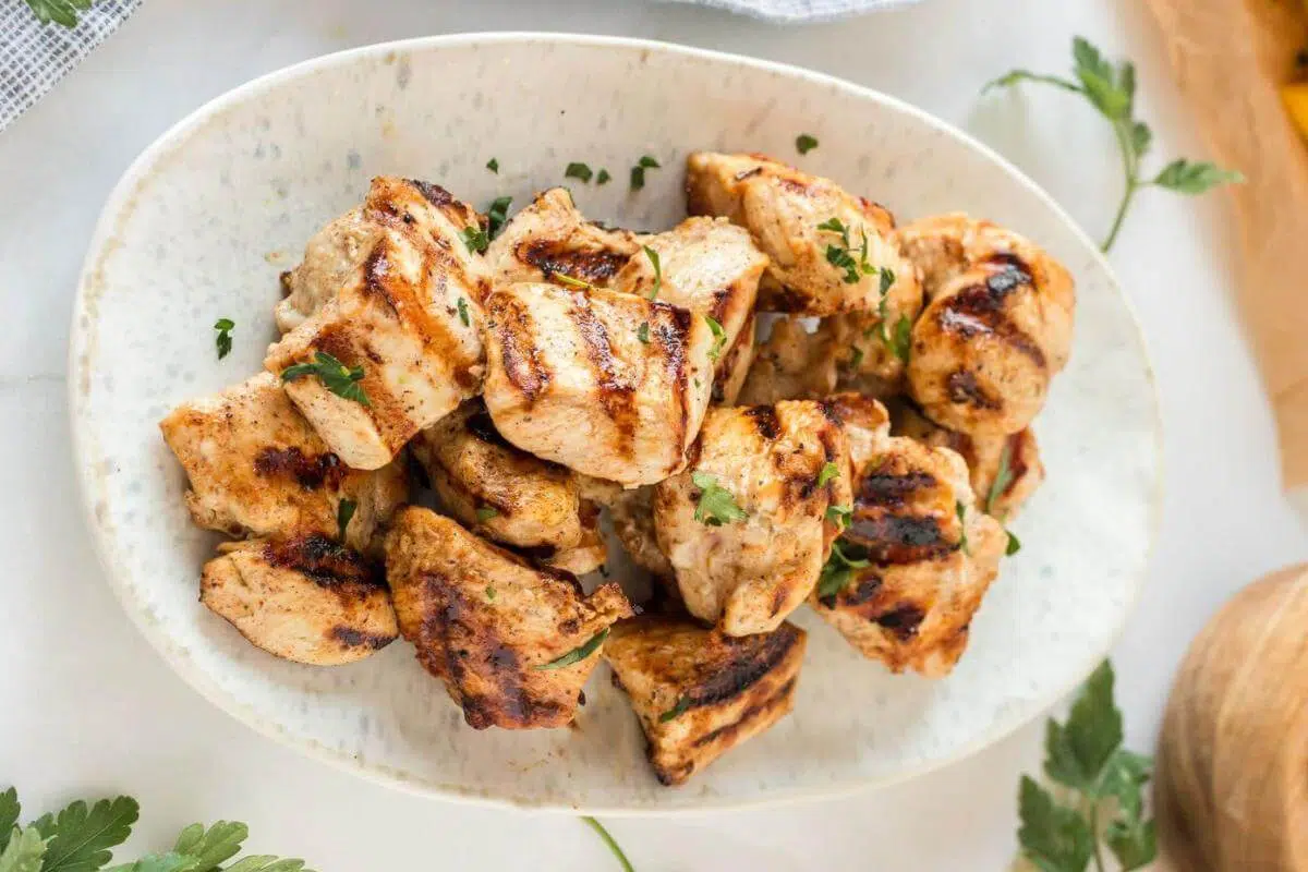 Grilled chicken nuggets on a plate.