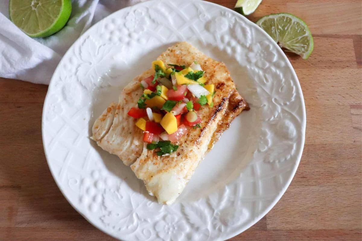 Grilled halibut on a plate.