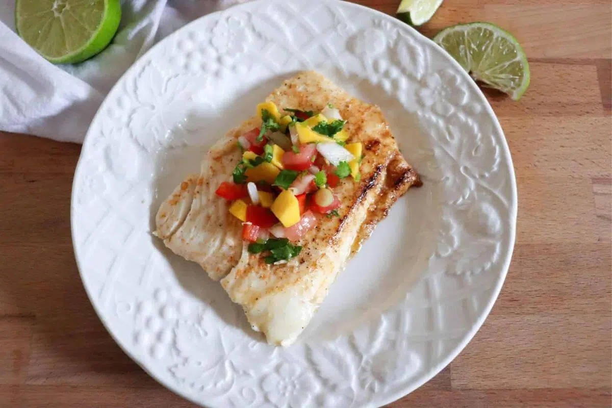 Grilled halibut on a plate.