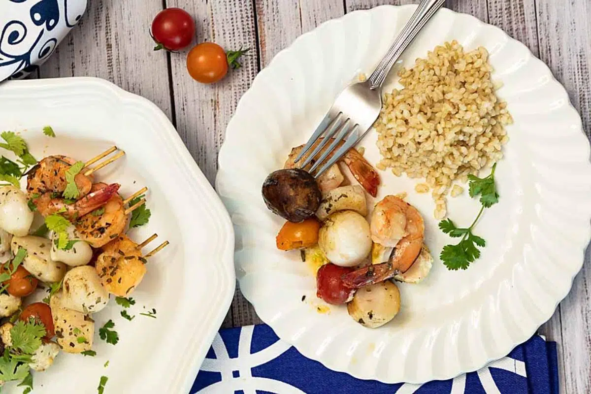 A seafood dish on white plates.