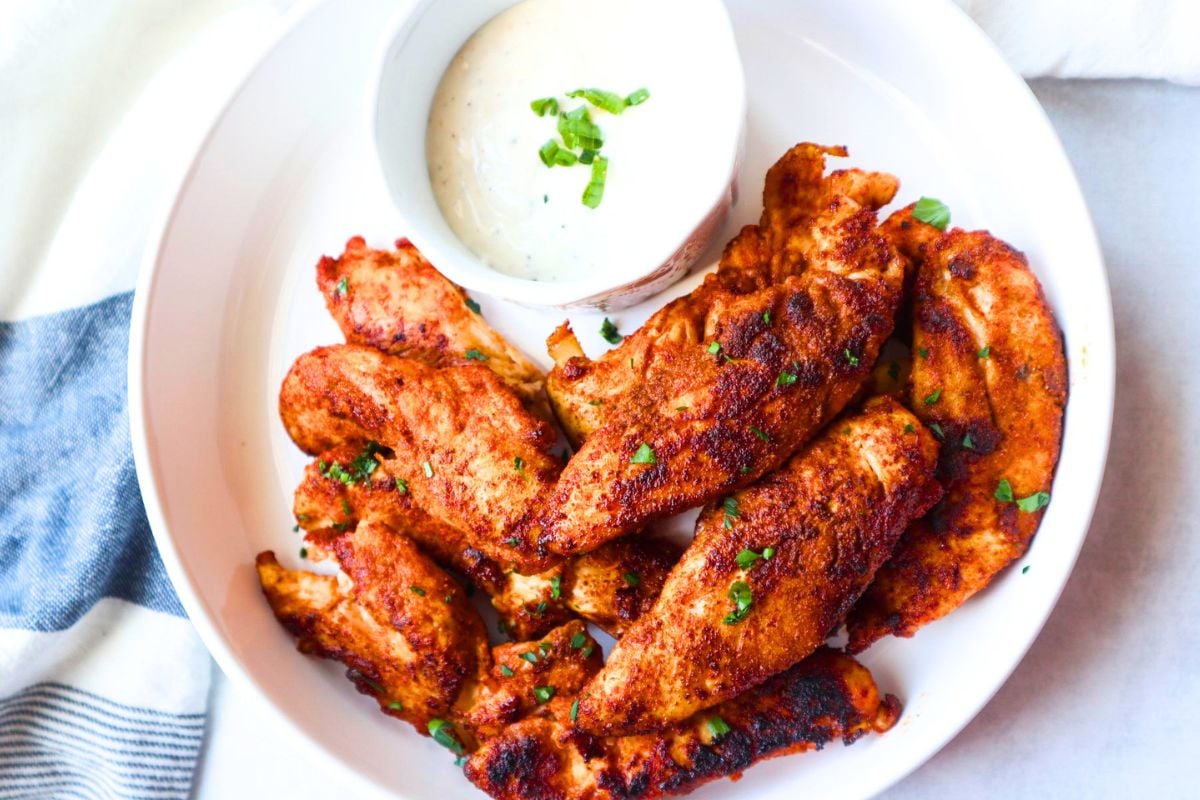 Air Fryer Blackened Chicken Tenders served on a plate.