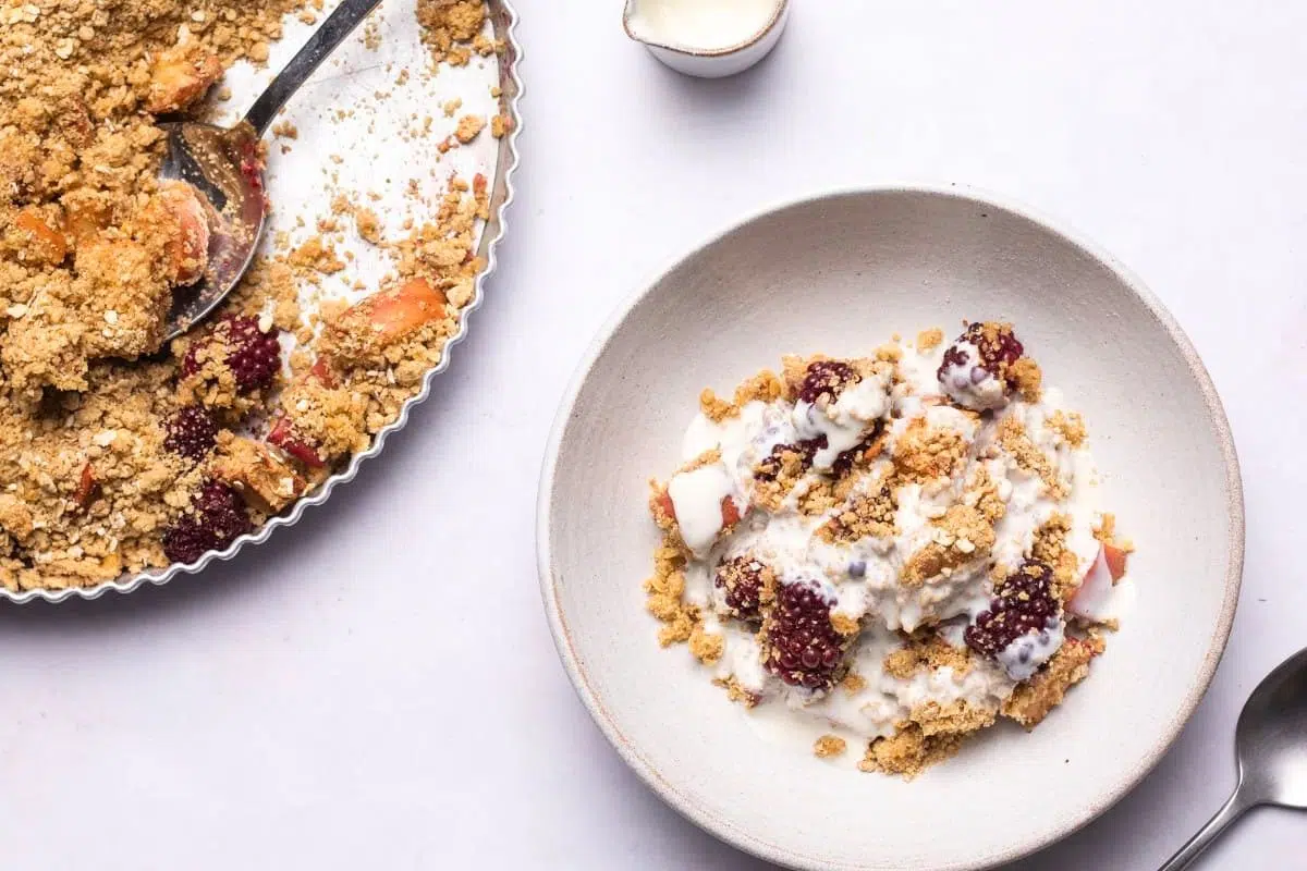 Apple and Blackberry Crumble served on a plate.