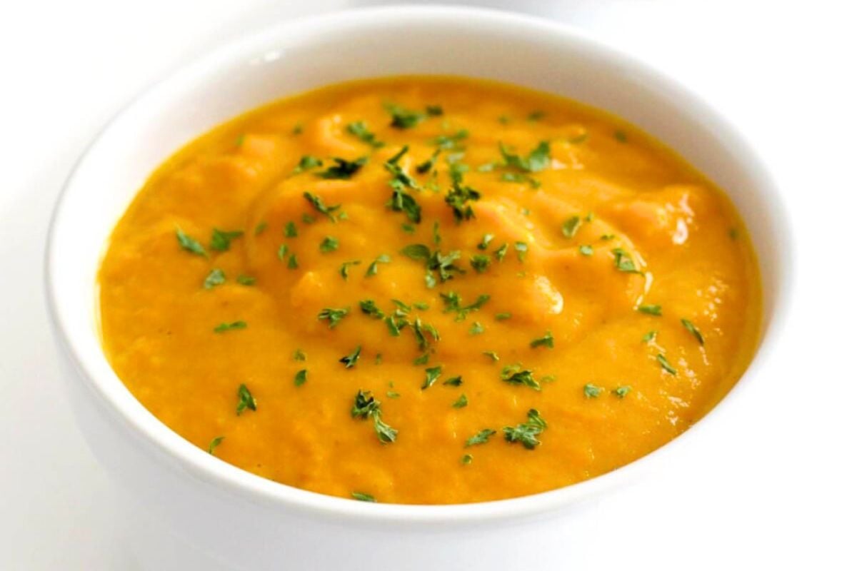 Vegan Curried Pumpkin Soup served in a bowl.