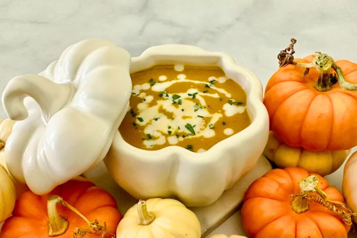 Pumpkin Soup garnished with chopped herbs.