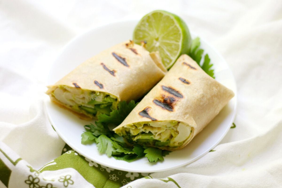 Grilled Green Goddess Wraps served with cilantro and a slice of lime.