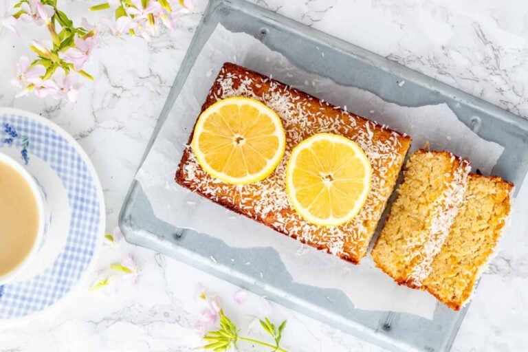 Healthy Lemon Coconut Bread topped with lemon slices.