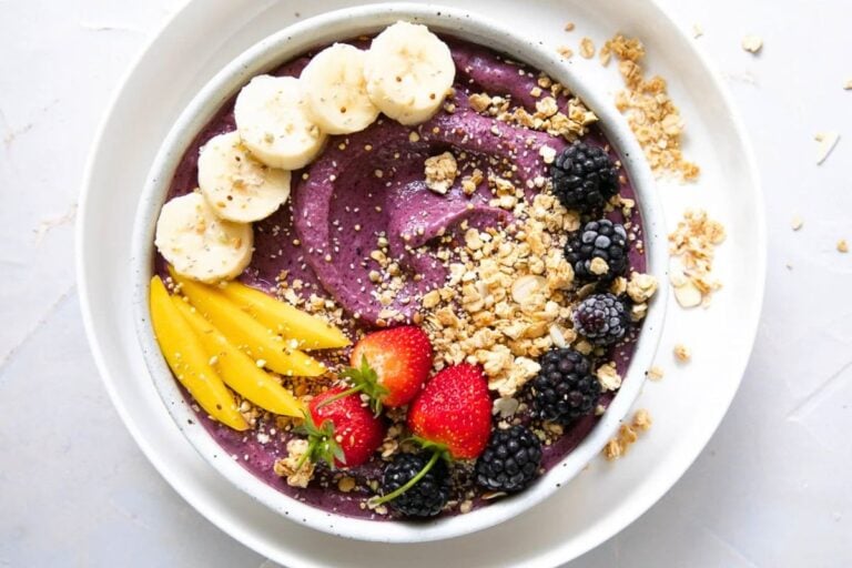 Acai Bowl topped with fruits.