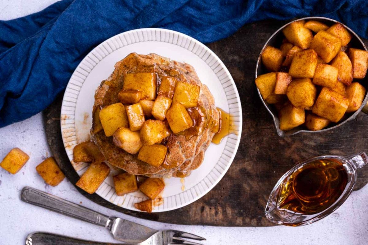 Apple Buckwheat Pancakes topped with diced apples.