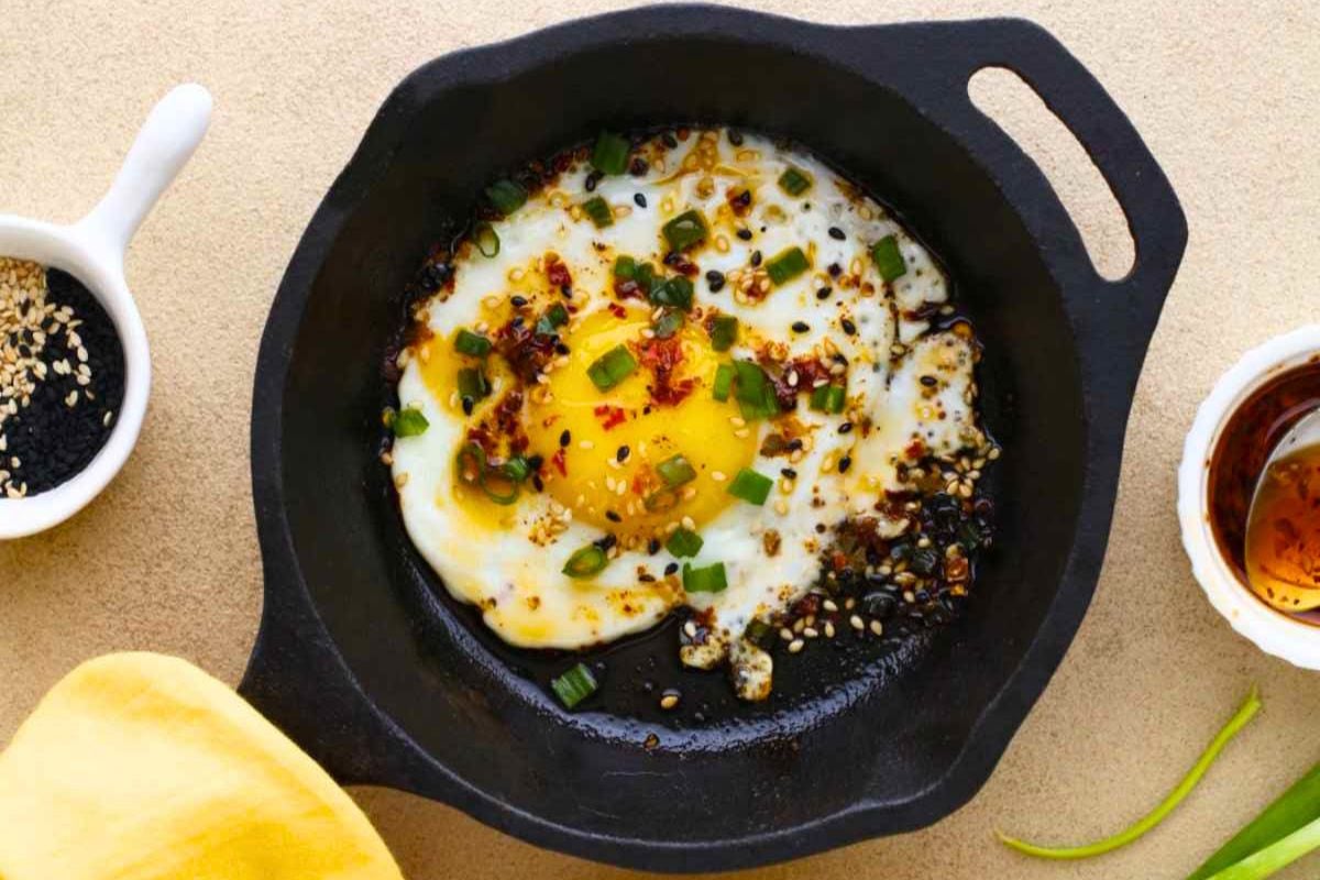 Chili Crisp Fried Eggs on a pan.
