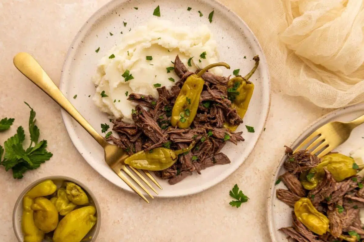 Mississippi pot roast and potatoes on a plate.